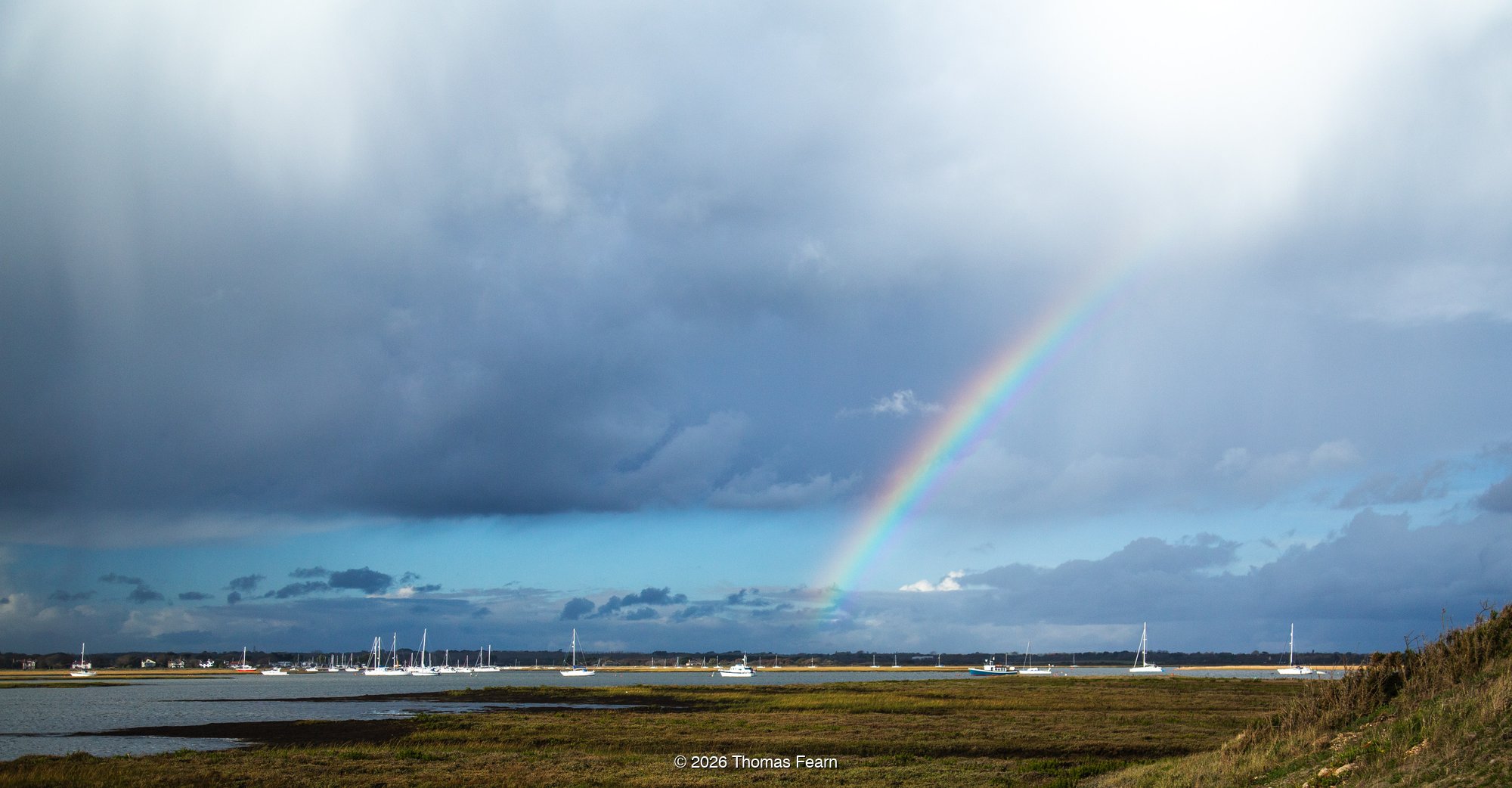 Rainbow Over a Coastal Harbour and Saltmarsh